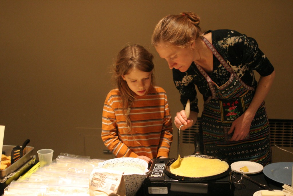 Ellie catching me with Felix as he wondered when a crepe is ready to flip.